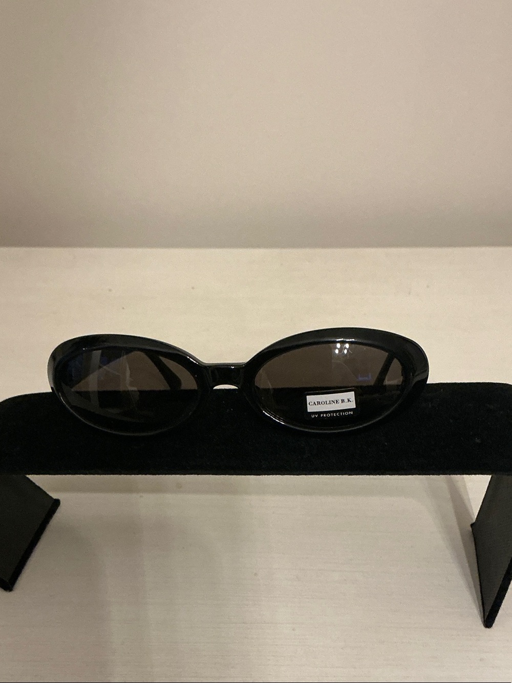 Caroline B. K., Black Oval Sunglasses with UV Protection